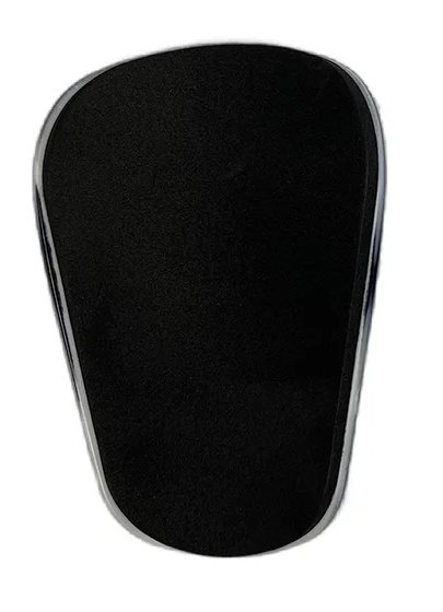 Foam-lined back of a matte black mini shin guard
