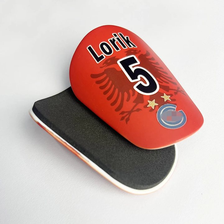 Red mini shin guard printed 'Lorik 5', shown with its foam-lined back