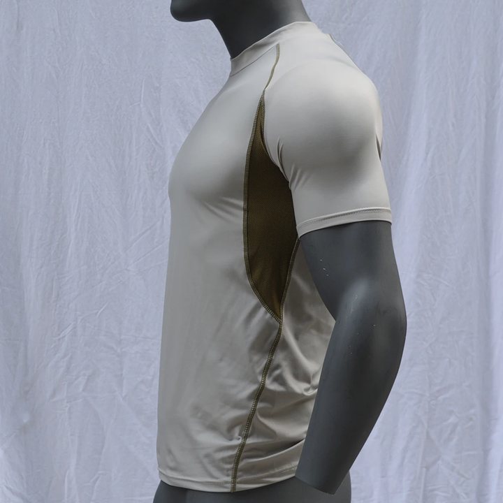 Beige short-sleeve rash guard on a mannequin, side view showing the mesh panel