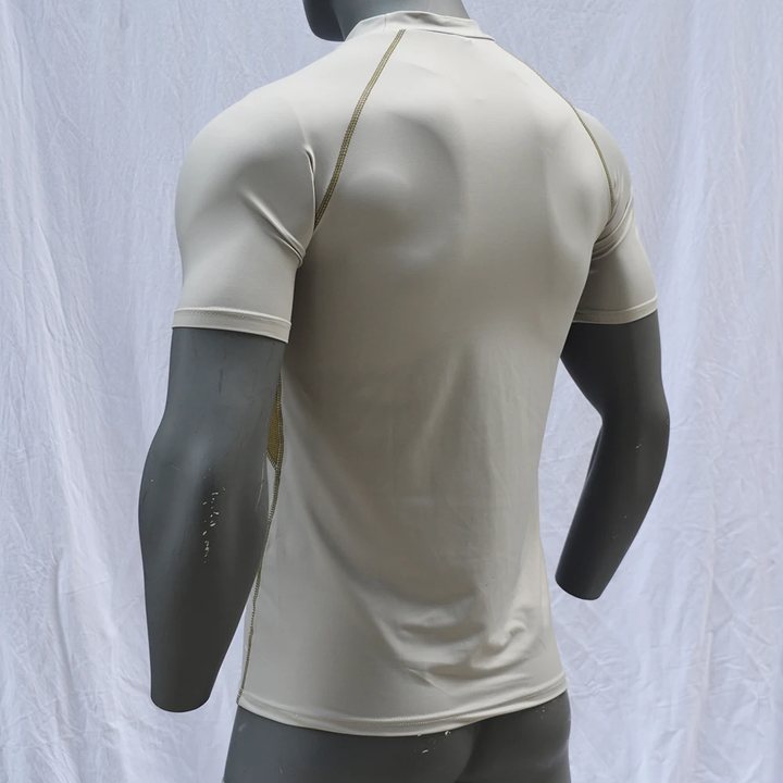 Beige short-sleeve rash guard on a mannequin, back view