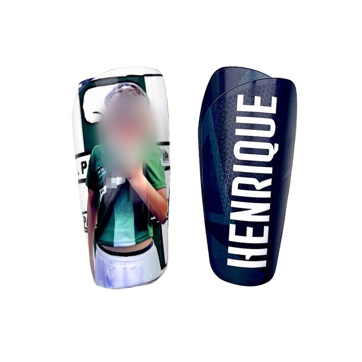 Custom shin guard pair: a photo-printed smooth guard beside a honeycomb guard printed 'HENRIQUE'