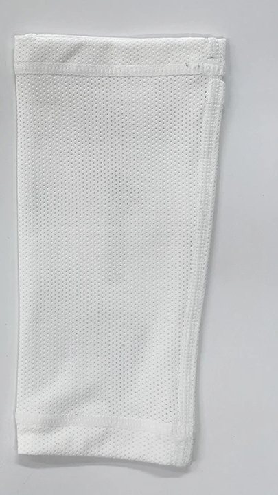 Plain white knitted shin guard sleeve, back side