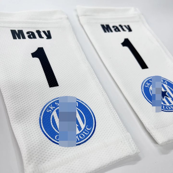 Pair of white shin guard sleeves printed 'Maty 1'